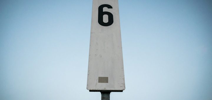 white and black p printed road sign