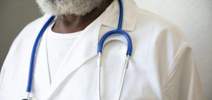 a person wearing a white lab coat