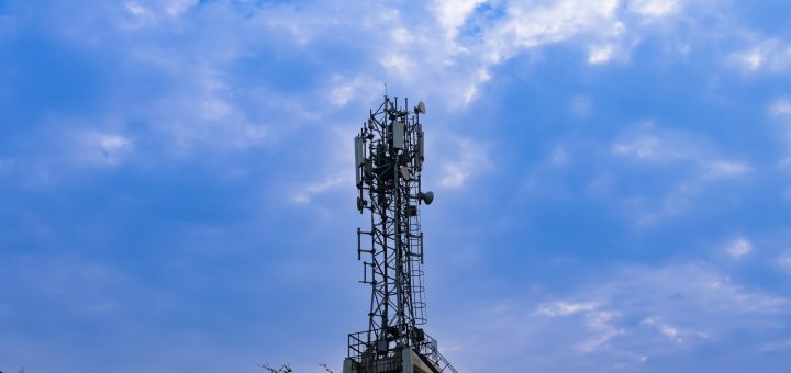 a tower with a cell phone on top of it